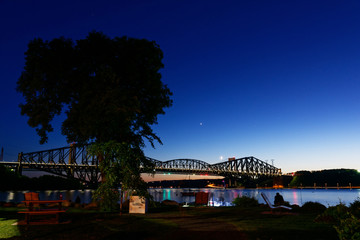 The Pont du Quebec and the St Lawrence River at dusk as seen from Parc de la Marina-de-la-Chaudière, St-Romuald