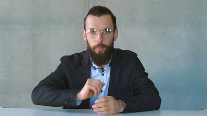 Secret business information from insider. Man gesturing finger on lips. Shush!