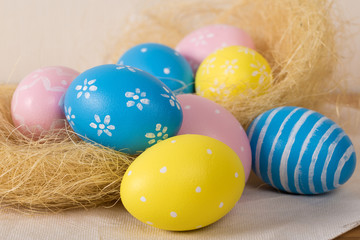 Easter eggs with colored eggs in nest