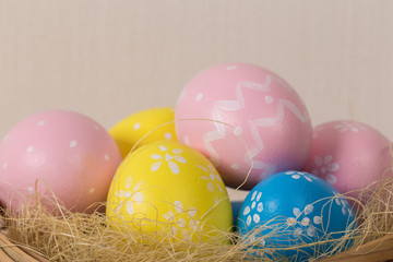Easter eggs with colored eggs in nest
