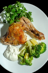 traditional fried chicken with vegetables sauce and greens