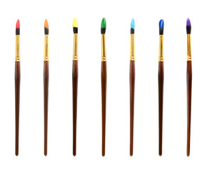 Set of colorful paint brushes on white background
