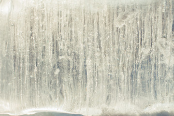 Ice bricks with bubbles of air inside. Abstract ice crystal texture. Clear ice background.