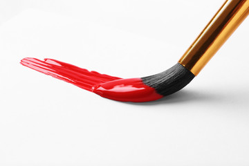 Brush with color paint and stroke on white background