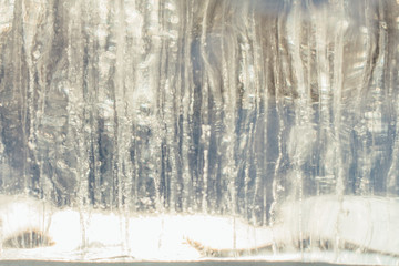 Ice bricks with bubbles of air inside. Abstract ice crystal texture. Clear ice background.