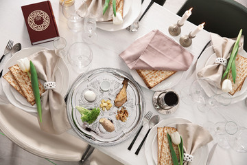 Festive Passover table setting with Torah, top view. Pesach celebration