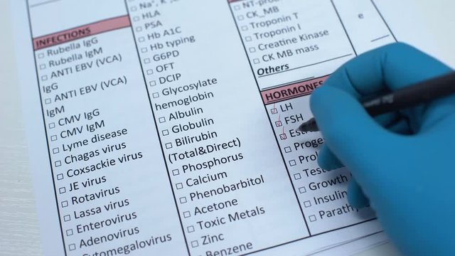Sex hormone test, doctor checking name in lab blank, showing blood sample