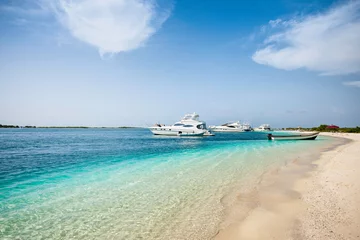 Foto op Canvas Yachts anchored near de beach in a beautiful place: Los Roques National Park, during a sunny day © DOUGLAS