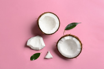 Flat lay composition with coconuts on color background