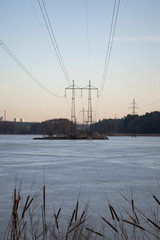 Fototapeta na wymiar Electric towers on a island on the lake.