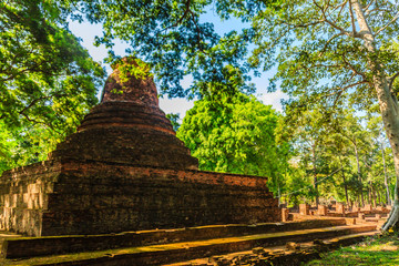 Lanka style ruins pagoda of Wat Mahathat temple in Muang Kao Historical Park, the ancient city of Phichit, Thailand. This tourist attraction is public historic site and free admission.