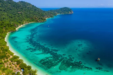 Foto op Plexiglas Aerial drone view of a beautiful tropical island surrounded by coral reefs and covered with lush, green jungle (Kyun Phi Lar, Myanmar) © whitcomberd