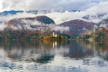 Beautiful autumn landscape around Lake Bled with Pilgrimage Church of the Assumption of Maria