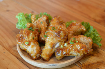 Chicken wings on top, topped with syrup