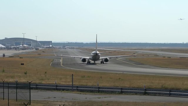 Passenger plane taxiing to the runway.