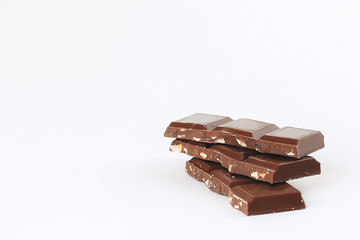 milk chocolate with nuts isolated on white.photo with copy space