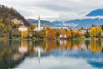 Beautiful autumn landscape around Lake Bled with St. Martin's Parish Church