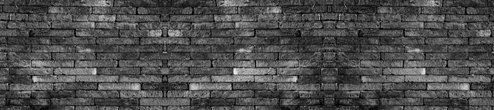Panorama black brick wall. The texture black stone blocks. Abstract background for design.