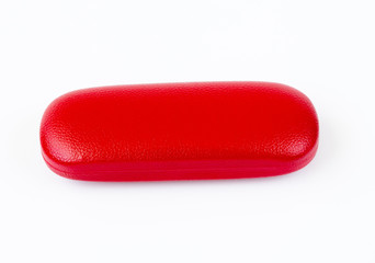 Closed red glasses case on white background