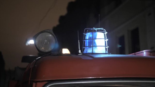 Red and blue blinking lights on top of the firetruck