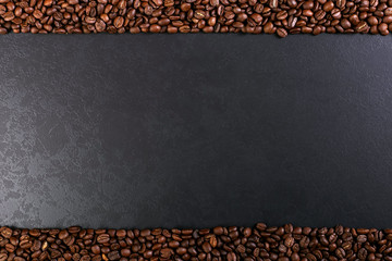 Aroma roasted coffee beans on rustic tabletop, brown banner background.