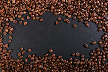 Aroma roasted coffee beans on rustic tabletop, brown banner background.