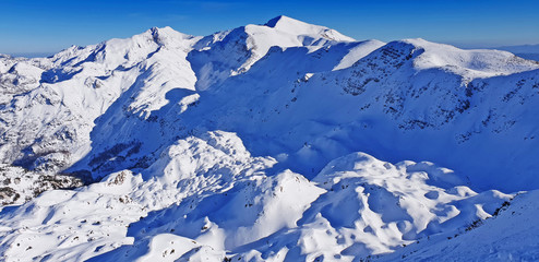 Panoramic view of the snowy mountains ski resort Vogel in Slovenia
