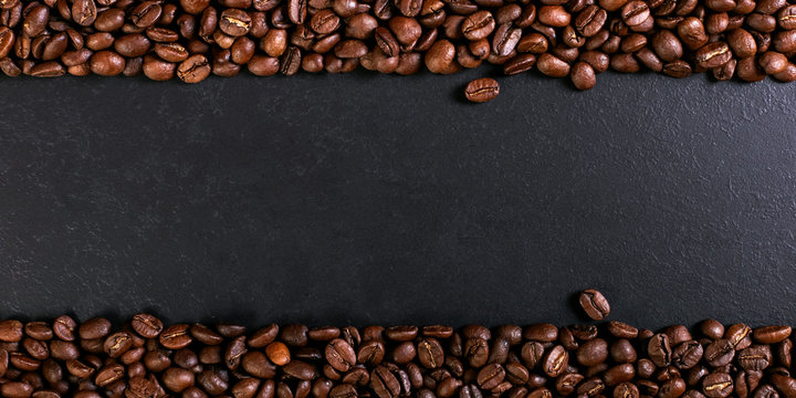 Aroma roasted coffee beans on rustic tabletop, brown banner background. © Plutmaverick