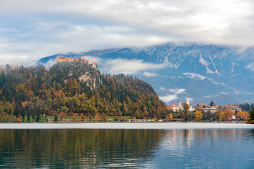 Beautiful autumn landscape around Lake Bled with the castle and St. Martin's Parish Church