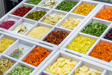 Dried vegetables in wooden box, onions, beets, carrots, pumpkin, bay leaf. Superfoods, herbs.