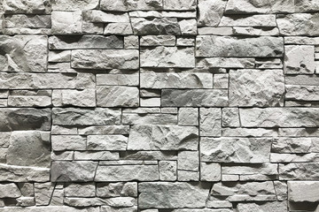 Stone wall with a grey color. Concept interior design background and texture