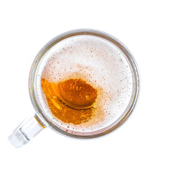 Mug of beer with bubble on glass isolated on white background top view