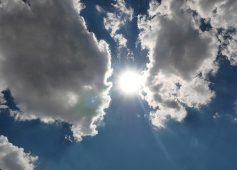 Fototapeta na wymiar clouds blue sky sun ray