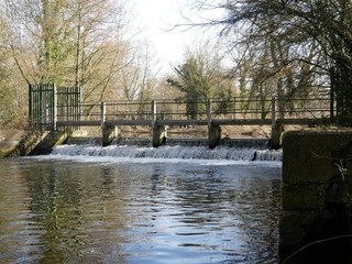 Weir on the River Colne at Rickmansworth Aquadrome, Hertfordshire, UK
