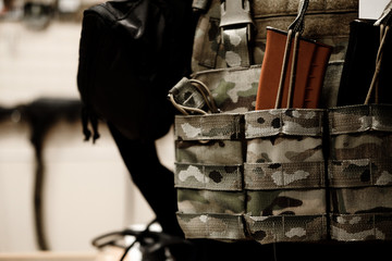 Soldier with camouflage bulletproof vest and Machine gun. Close up. mock up. Toned