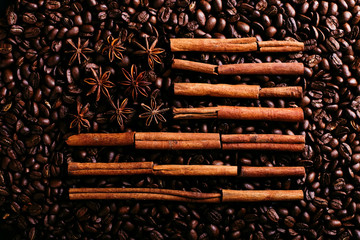 Coffee beans, star anise and cinnamon in the shape of the American flag. Fragrant spices for coffee drink, close-up, concept americano.