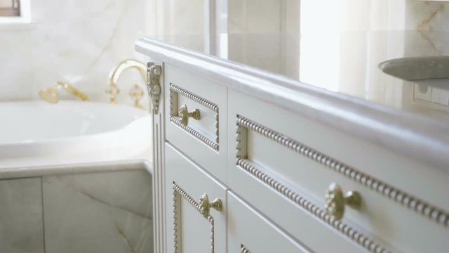 The interior of a luxurious bathroom. Close-up of furniture. Slow motion. HD