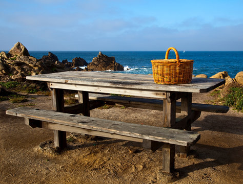 Picnic Basket on Wooden Picnic Table