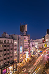 Fototapeta premium Bird’s view of the Japanese youth culture fashion’s district crossing intersection of Harajuku Laforet named champs-élysées in Tokyo, Japan at night.