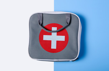 First aid kit on color white blue background,flat lay, top view