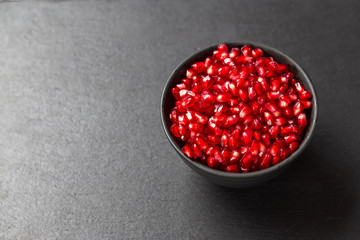 pomegranate fruit on black background