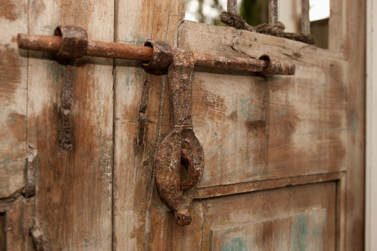Old Iron Door Latch on Wooden Door