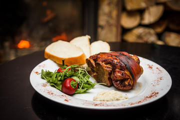 roasted pork knuckle with bread and horseradish