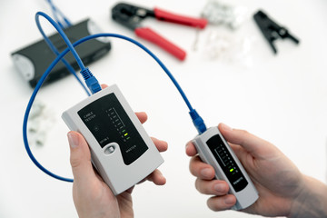 Man using a qualified cable performance tester