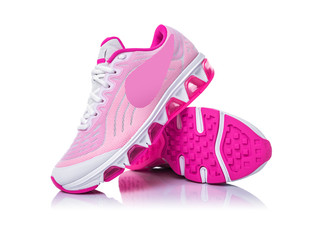 Pink sport shoes isolated on white background.