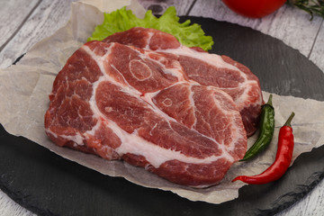 Raw pork neck steak