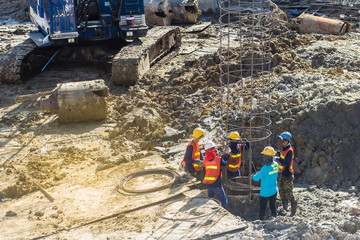 Construction worker put rolled deformed steel bars or steel reinforcement bar fabricated for...