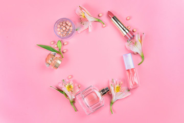  Flat lay on a pink background with makeup cosmetics. Beauty concept.