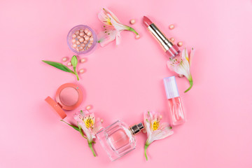 Fototapeta na wymiar Flat lay on a pink background with makeup cosmetics. Beauty concept.
