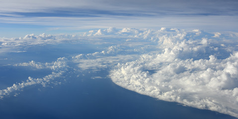 cloud with blue sky taken from airplane, dramatic clouds